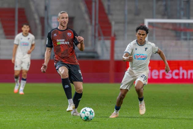 Ingolstadt, Germany, August 8, 2026, 3rd League 2026–2027, Matchday 6: FC Ingolstadt 04 vs. TSG Hoffenheim II. Pictured from left, in a tackle: Vinko Sapina (FCI) and Tiago Poller (TSG II). DFB and DFL regulations prohibit any use of photographs as image sequences and or quasi-video. Audi Sportpark Bayern Copyright: xFotostandx xSchäferx