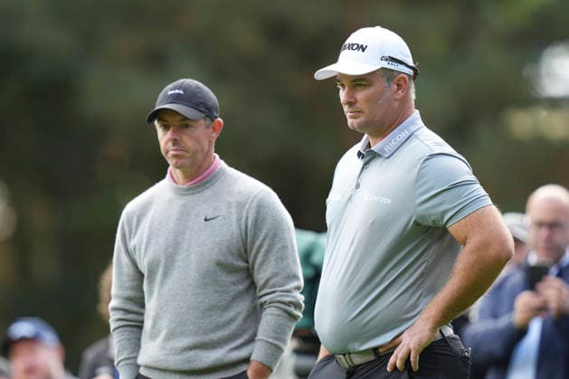 VIRGINIA WATER, ENGLAND - SEPTEMBER 17: Rory McIlroy (IRE) and Ryan Fox (NZL) wait on the first green during Round 1 at the BMW PGA, Golf Herren Championship at Wentworth Golf Club, Virginia Water on September 17, 2026 in Surrey, England The BMW PGA Championship