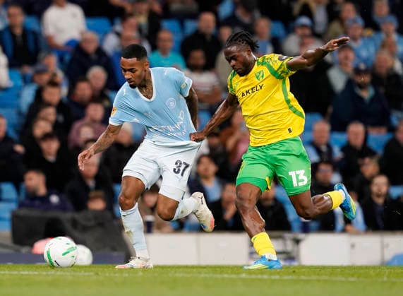 Manchester, England, 17th September 2026. Allan Elias of Manchester City tussles with Darlin Yongwa of Norwich City during the Manchester City vs Norwich City Carabao Cup match at the Etihad Stadium, Manchester. Picture credit should read: Andrew Yates Sportimage EDITORIAL USE ONLY. No use with unauthorised audio, video, data, fixture lists, club league logos or live services. Online in-match use limited to 120 images, no video emulation. No use in betting, games or single club league player publications. SPI_017_AY_Man_City_Norwich SPI-5003-0017