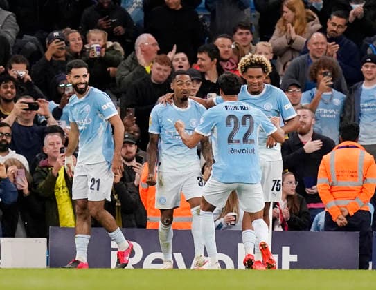 Manchester, England, 17th September 2026. Allan Elias of Manchester City (2l) celebrates scoring their third goal during the Manchester City vs Norwich City Carabao Cup match at the Etihad Stadium, Manchester. Picture credit should read: Andrew Yates Sportimage EDITORIAL USE ONLY. No use with unauthorised audio, video, data, fixture lists, club league logos or live services. Online in-match use limited to 120 images, no video emulation. No use in betting, games or single club league player publications. SPI_040_AY_Man_City_Norwich SPI-5003-0040