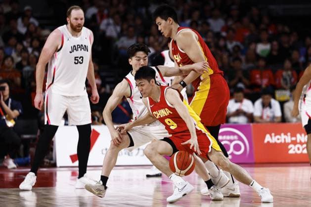 Aichi-Nagoya Asian Games: Basketball China s Pang Zhenglin (9) dribbles the ball during the third quarter of a men s basketball semifinal match against Japan at the Aichi-Nagoya Asian Games at Aichi International Arena in Nagoya, central Japan, on Sept. 18, 2026.  A14AA0005627849P