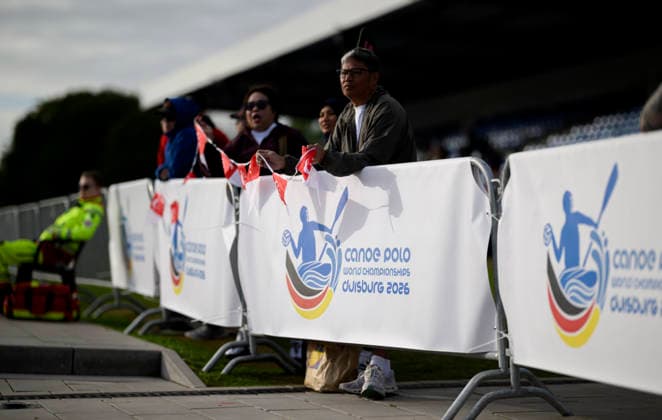 Fans from Malaysia behind the World Championship banner featuring the Malaysia Women s logo on September 18, 2026, at the Canoe Polo World Championship held from September 15 to September 20, 2026, at the Regattabahn in Duisburg, Germany