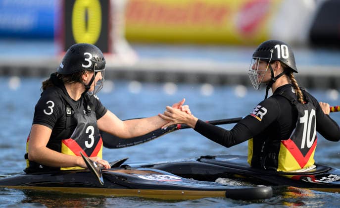 l r OEZBAY, ESRA GER, GRUENEWALD, KATHARIN GER high-fiving each other, Women’s Germany vs. Italy, on September 18, 2026, at the Canoe Polo World Championships from September 15–20, 2026, at the Duisburg Regatta Course in Germany