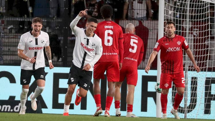 September 18, 2026, xfsx, Men s, Soccer, 2026–2027 Season, 3rd Division, Matchday 7: SC Verl vs. FC Würzburger Kickers; from left: Tim Heike (SC Verl), Almin Mesanovic (SC Verl) celebrating the goal; goal celebration, Celebrating the 2–0 goal, Namrud Embaye (FC Würzburger Kickers), Leo Eberle (FC Würzburger Kickers), Dominik Meisel (FC Würzburger Kickers), Verl Sportclub Arena, North Rhine-Westphalia, Germany
