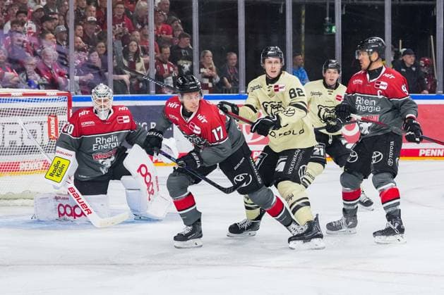 Ice Hockey: Penny DEL Matchday 1—Cologne Sharks vs. Wolfsburg Grizzlys on September 18, 2026, at the Lanxess Arena in Cologne (from left to right): Janne Juvonen (Cologne), Jan Luca Sennhenn (Cologne), Will Graber (Wolfsburg), Moritz Müller (Cologne). In accordance with the guidelines of the DEL (German Ice Hockey League), the publication and reuse of these images in electronic media and on devices of any kind during the game is not permitted. xDMx