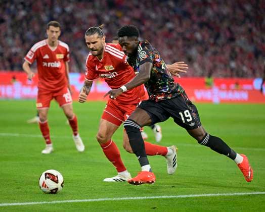 September 18, 2026, 2026–2027 Bundesliga Season, Matchday 4, FC Bayern Munich vs. 1. FC Union Berlin, at the Allianz Arena in Munich, Alphonso Davies of FC Bayern Munich comes out on top