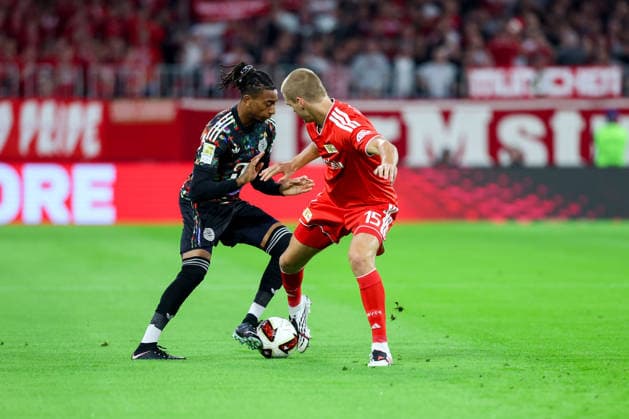 September 18, 2026, Germany, Soccer, Men s, Bundesliga 1, 2026–2027 Season, Matchday 4, FC Bayern Munich vs. 1. FC Union Berlin: Michael Olise (FC Bayern Munich, No. 17), left; Tom Rothe (1. FC Union Berlin, No. 15), right. DFB and DFL regulations prohibit any use of photographs as image sequences and or quasi-video. Munich, Allianz Arena, Bayern, Germany Copyright: xNordphoto Schneiderx