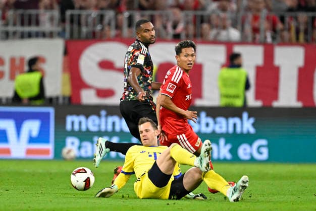September 18, 2026, 2026–2027 Bundesliga, Matchday 4, FC Bayern Munich vs. 1. FC Union Berlin, at the Allianz Arena in Munich, Woo Yeong Jeong of Union Berlin is denied by goalkeeper Manuel Neuer of FC Bayern Munich
