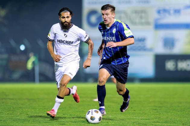 September 18, 2026, xkwix, Soccer, Regionalliga West, SV Rödinghausen vs. FC Gütersloh, Häcker Wiehenstadion, Matchday 9, 2026–2027 season: Aleksandar Kandic of FC Gütersloh 27 in a tackle against Mika Polat of SV Rödinghausen 8. DFB regulations prohibit any use of photographs as image sequences and or quasi-video. Photo: xKamilxWilkowskixPressefotoKochx, North Rhine-Westphalia, Germany