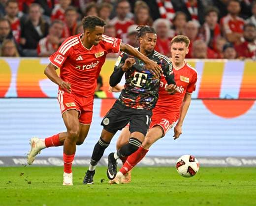 September 18, 2026, 2026–2027 Bundesliga Season, Matchday 4, FC Bayern Munich vs. 1. FC Union Berlin, at the Allianz Arena in Munich, Felix Uduokhai (Union Berlin) vs. Michael Olise (FC Bayern Munich)