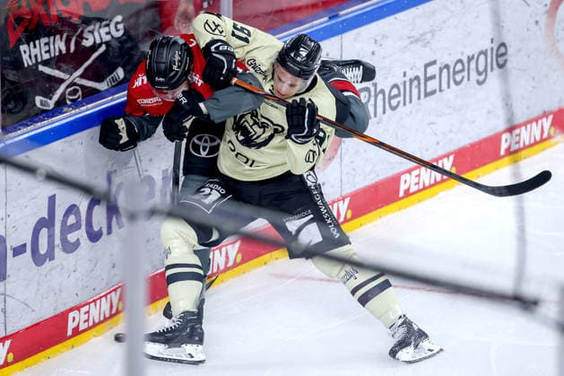 September 18, 2026, Ice hockey, DEL, Kölner Haie vs. Grizzlys Wolfsburg, Matchday 1, 2026–27 season, Lanxess Arena, Cologne; Robin Press (Kölner Haie, 94) in a one-on-one battle against Timo Ruckdäschel (Grizzlys Wolfsburg, 91), North Rhine-Westphalia, Germany