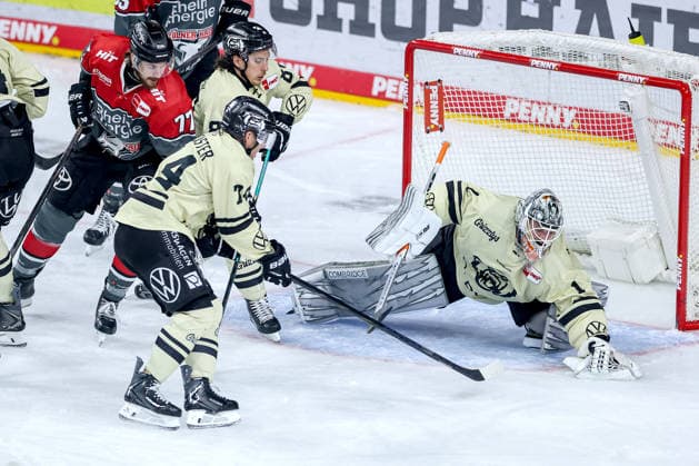 September 18, 2026, Ice hockey, DEL, Kölner Haie vs. Grizzlys Wolfsburg, Matchday 1, 2026–27 season, Lanxess Arena, Cologne. Goalie Dustin Strahlmeier of the Grizzlys Wolfsburg 01 defends against Ryan MacInnis of the Kölner Haie 77, North Rhine-Westphalia, Germany