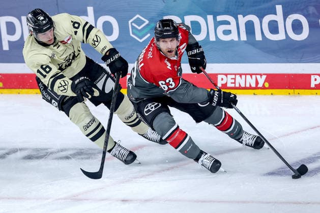 September 18, 2026, Ice Hockey, DEL, Kölner Haie vs. Grizzlys Wolfsburg, Matchday 1, 2026–27 Season, Lanxess Arena, Cologne; Tommy Pasanen (Grizzlys Wolfsburg, 16) in a one-on-one battle against Patrick Russell (Kölner Haie, 63); North Rhine-Westphalia, Germany