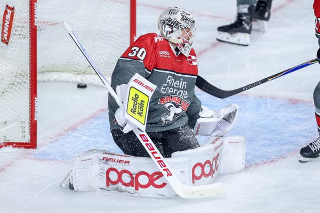 September 18, 2026, Ice hockey, DEL, Kölner Haie vs. Grizzlys Wolfsburg, Matchday 1, 2026–27 season, Lanxess Arena, Cologne. Goalie Janne Juvonen of the Kölner Haie, number 30, looks disappointed after the goal that tied the game at 3–3. North Rhine-Westphalia, Germany