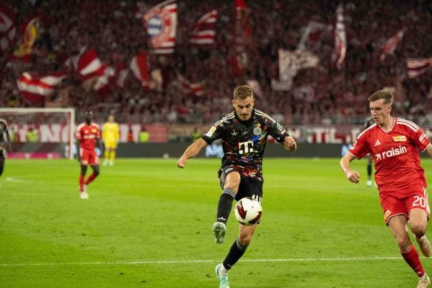 September 18, 2026: FC Bayern Munich vs. Union Berlin, Matchday 4 of the Bundesliga at the Allianz Arena in Munich; Josip Stanisic (FC Bayern Munich), 44, vs. Michel Aebischer (Union Berlin), 20 IMPORTANT NOTICE: In accordance with DFL and DFB regulations, it is prohibited to use or allow the use of photographs taken in the stadium and or during the game in the form of sequential images and or video-like photo series. Copyright: xJamesxZabelx