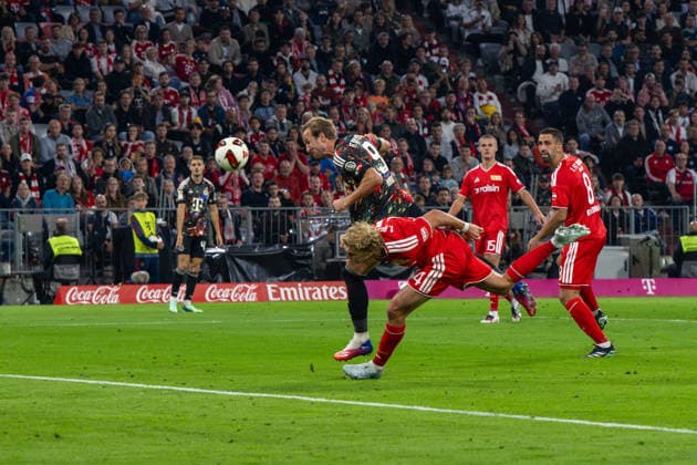 Soccer, Men s, 2026–2027 Season, Bundesliga 1, Matchday 4, FC Bayern Munich vs. 1. FC Union Berlin; Harry Kane of Bayern Munich scores the goal to make it 4–0 against Leopold Querfeld of 1. FC Union Berlin and Rani Khedira of 1. FC Union Berlin, September 18, 2026, Copyright: xMatthiasxKochx