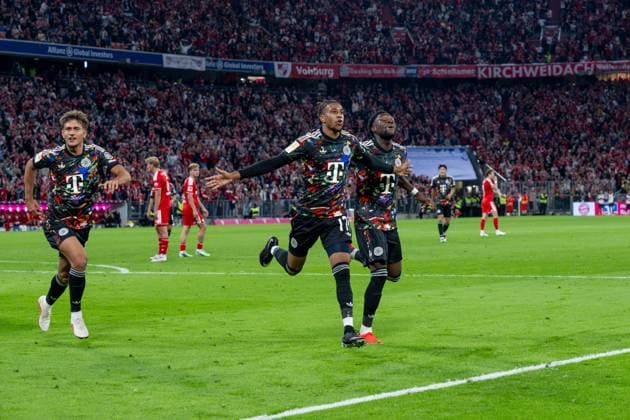 Soccer, Men s, 2026–2027 Season, Bundesliga 1, Matchday 4, FC Bayern Munich 1 FC Union Berlin, from left: Tom Bischof (Bayern Munich), Michael Olise (Bayern Munich), Alphonso Davies (Bayern Munich), celebrating after the goal that made it 7–0, September 18, 2026, Copyright: xMatthiasxKochx