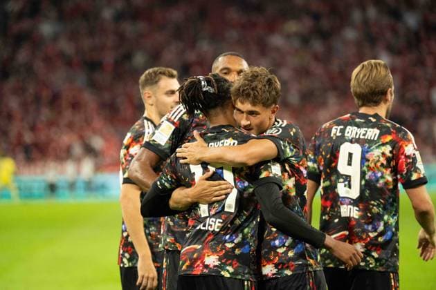 September 18, 2026: Soccer – FC Bayern Munich vs. Union Berlin, Matchday 4 of the Bundesliga at the Allianz Arena in Munich. Goal celebration by Michael Olise (FC Bayern Munich, 17) and Tom Bischof (FC Bayern Munich), 8, for a 6–0 victory. IMPORTANT NOTICE: In accordance with DFL and DFB regulations, it is prohibited to use or allow the use of photographs taken in the stadium and or during the game in the form of sequential images and or video-like photo series. Copyright: xJamesxZabelx