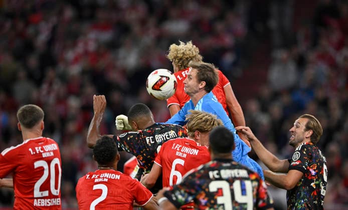 Penalty area scene, Goalmouth action, header duel, tackle, goalkeeper Frederik Roennow, 1. FC Union Berlin (FCU) 01, Jonathan Tah, FC Bayern Munich (FCB) 04, Ismael Saibari, FC Bayern Munich (FCB) 34, Felix Uduokhai, 1. FC Union Berlin (FCU) 02, Michel Aebischer 1 FC Union Berlin FCU 20 Harry Kane FC Bayern Munich FCB 09 FC Bayern Munich FCB vs. 1 FC Union Berlin FCU September 18, 2026 DFL regulations prohibit any use of photographs as image sequences AND OR QUASI-VIDEO FC Bayern Munich FCB vs 1 FC Union Berlin FCU