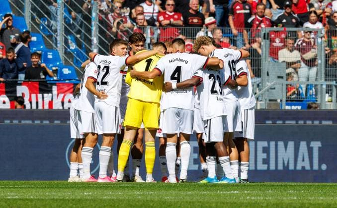 September 19, 2026 Soccer Season 2026–2027, 2nd Matchday of the Bundesliga, Matchday 6: Karlsruher SC (KSC) vs. 1. FC Nürnberg (FCN) Club Sports Photo by Zink DaMa xdaxmax DFL regulations prohibit any use of photographs as image sequences and or quasi-video For editorial use only: FCN team posing in a circle before kickoff