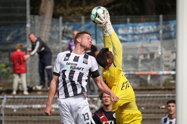 3rd Division, 2026–27 Season: Viktoria Köln vs. FC Ingolstadt 04; Lars Lokotsch (No. 13), FCI; Arne Schulz (No. 1), Viktoria Köln; Photo by Jürgen Meyer; 3rd Division, 2026–27 Season: Viktoria Köln vs. FC Ingolstadt 04