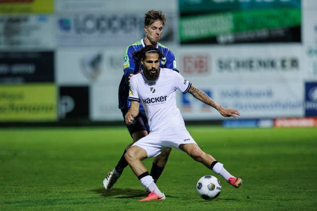 September 18, 2026, xkwix, Soccer, Regionalliga West, SV Rödinghausen vs. FC Gütersloh, Häcker Wiehenstadion, Matchday 9, 2026–2027 Season: Jannik Borgmann of FC Gütersloh (No. 34) in a tackle against Mika Polat of SV Rödinghausen (No. 8). DFB regulations prohibit any use of photographs as image sequences and or quasi-video. Photo: xKamilxWilkowskixPressefotoKochx, North Rhine-Westphalia, Germany