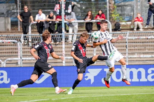 September 19, 2026, xsefx, Soccer, FC Viktoria Köln vs. FC Ingolstadt 04, 3. Liga, Sportpark Höhenberg, Matchday 7, 2026–2027 Season: Georgios Antzoulas of FC Ingolstadt 04 (No. 06) in a tackle against Niklas Swider of FC Viktoria Köln. DFB regulations prohibit any use of photographs as image sequences and or quasi-video. North Rhine-Westphalia, Germany