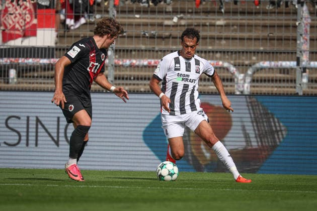 3rd Division, 2026–27 Season: Viktoria Köln vs. FC Ingolstadt 04; Nishan Velupillay (No. 28, FCI) and Tobias Eisenhut (No. 6, Viktoria Köln); Photo by Jürgen Meyer; 3rd Division, 2026–27 Season: Viktoria Köln vs. FC Ingolstadt 04