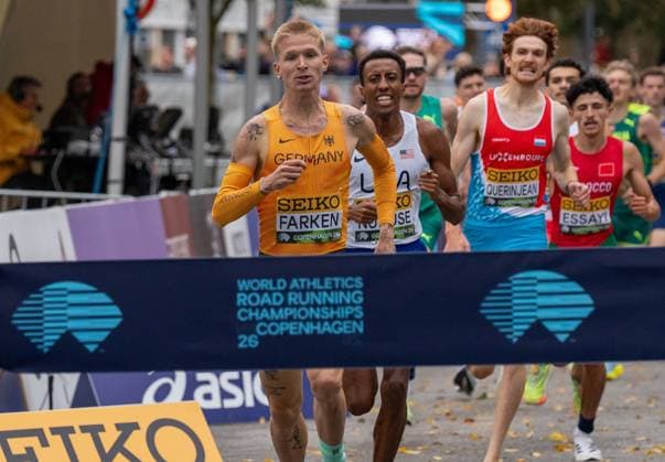(260919) -- DENMARK, Sept. 19, 2026 -- Robert Farken of Germany (front) sprints towards the finish line during the men s road mile at the World Athletics Road Running Championships in Copenhagen, Denmark, Sept. 19, 2026. (Photo by Xinhua) (SP)DENMARK-COPENHAGEN-WORLD ATHLETICS ROAD RUNNING CHAMPIONSHIPS AndersxKongshaug 