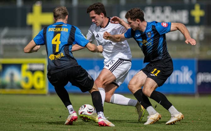 Soccer, 2026–2027 Season, Regionalliga West, September 19, 2026, Matchday 9, Men s, 1 FC Bocholt (white) vs. SC Wiedenbrücken (black) – L Julius Bochmann (SC Wiedenbrücken), Lennart Garlipp (1 FC Bocholt), Maik Amedick (SC Wiedenbrücken), Bocholt Stadion am Huenting, Germany 260919_fb_1fc-bocholt_sc-wiedenbrueck_59009