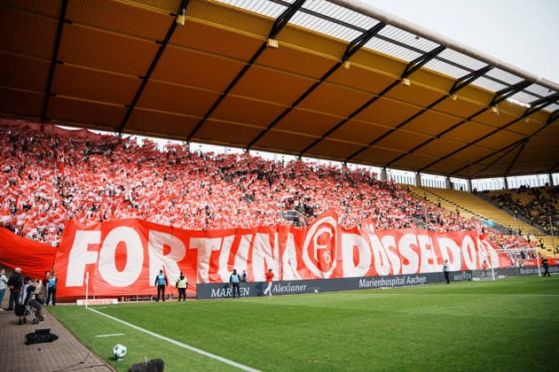 German Soccer 3rd Division 2026–2027, Matchday 7: Alemannia Aachen vs. Fortuna Düsseldorf at Tivoli Aachen; pre-game flag display, away section, Fortuna fans Copyright: xThiemoxRudolphx
