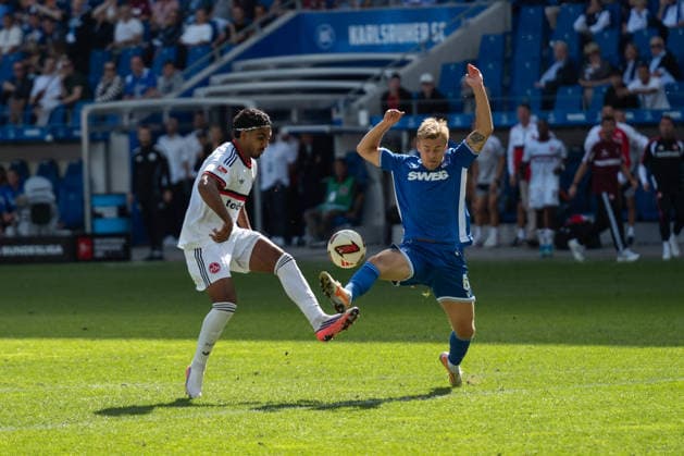 September 19, 2026, xjyhynx, Soccer 2. Bundesliga, Karlsruher SC vs. 1. FC Nürnberg, from left: Rayan Ghrieb 7, 1 FC Nürnberg in a tackle with Santeri Väänänen 6, Karlsruher SC DFL DFB REGULATIONS PROHIBIT ANY USE OF PHOTOGRAPHS AS IMAGE SEQUENCES AND OR QUASI-VIDEO Karlsruhe