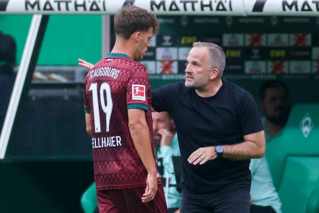 Robin Fellhauer of FC Augsburg and coach Manuel Baum of FC Augsburg talk during the Bundesliga 1 match between SV Werder Bremen and FC Augsburg at Weserstadion on September 19, 2026, in Bremen, Germany. Photo by Marco Steinbrenner, DeFodi Images. Robin Fellhauer of FC Augsburg and coach Manuel Baum of FC Augsburg talk together during the Bundesliga match between SV Werder Bremen and FC Augsburg at Weserstadion on September 19, 2026 in Bremen, Germany. Photo by Marco Steinbrenner, DeFodi Images. DFB and DFL regulations prohibit any use of photographs as image sequences and or quasi-video. Photo by Marco Steinbrenner, DeFodi Images.