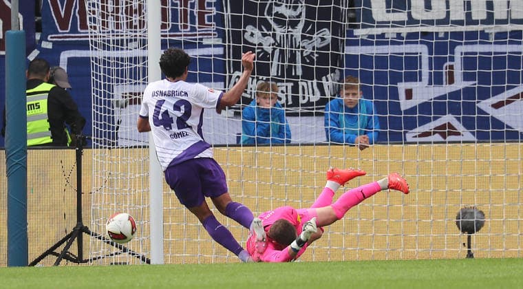 Jonathan Gomez of VfL Osnabrück is denied by goalkeeper Timon Weiner, Holstein Kiel Soccer, Men s, 2026–2027 Season, 2. Bundesliga, Holstein Stadium, Holstein Kiel vs. VfL Osnabrück, 1–1. DFL regulations prohibit any use of photographs as image sequences and or quasi-video.
