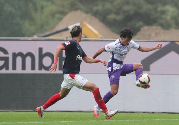Hiroki Sekine, Holstein Kiel; Jonathan Gomez, VfL Osnabrück; Soccer, Men’s, 2026–2027 Season, 2. Bundesliga, Holstein Stadium, Holstein Kiel vs. VfL Osnabrück, 1–1. DFL regulations prohibit any use of photographs as image sequences and or quasi-video.