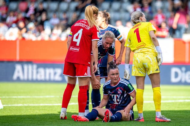 Marina Hegering, 33, of Cologne, sits injured in the penalty area during the Google Pixel Women s Bundesliga match between FC Bayern Munich and 1. FC Cologne on September 19, 2026, at the FC Bayern Campus in Munich, Bavaria, Germany
