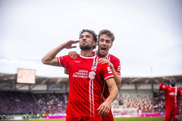 Erfurt, 09 26 1909, Soccer: Northeast Regional League—FC Rot-Weiß Erfurt vs. Erzgebirge Aue. Pictured: Romario Hajrulla of Erfurt celebrates the 1-0 goal with Laurenz Dehl of Erfurt.