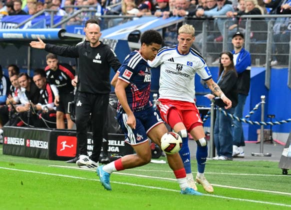 September 19, 2026, German Soccer, Men, 1st Division, Matchday 4, 2026–2027 Season, Hamburg, Hamburger SV vs. 1. FC Köln. Albert Grönbaek (HSV 11) tries to get past Jahmai Simpson Pusey (Köln 22). DFB and DFL regulations prohibit any use of photographs as image sequences and or quasi-video. Hamburg Volksparkstadion, Hamburg, Germany Copyright: xnordphotoxGmbH xWitkex