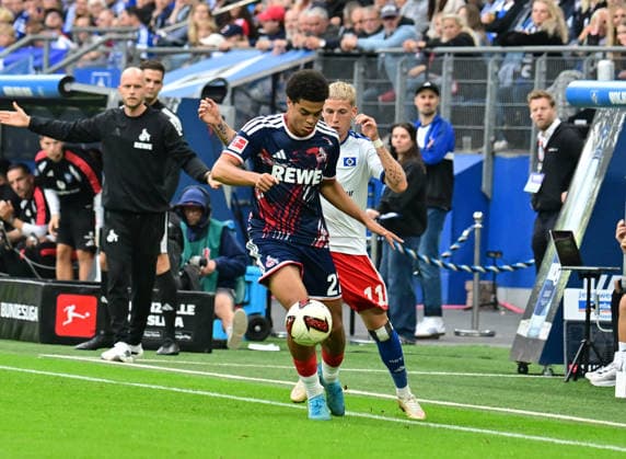 September 19, 2026, German Soccer, Men, 1st Division, Matchday 4, 2026–2027 Season, Hamburg, Hamburger SV vs. 1. FC Köln. Albert Grönbaek (HSV 11) tries to get past Jahmai Simpson Pusey (Köln 22). DFB and DFL regulations prohibit any use of photographs as image sequences and or quasi-video. Hamburg Volksparkstadion, Hamburg, Germany Copyright: xnordphotoxGmbH xWitkex