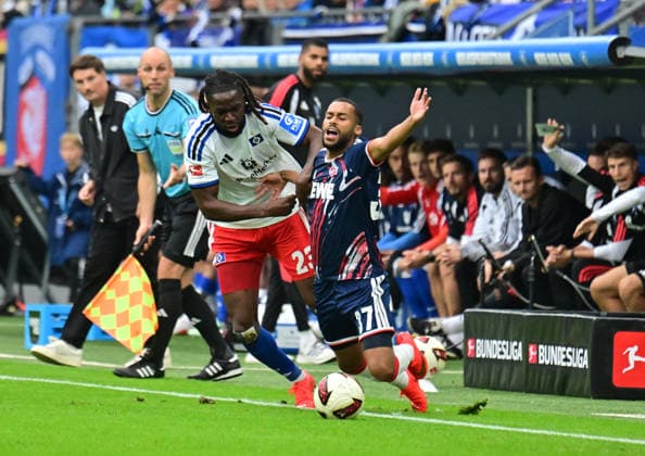 September 19, 2026, German Soccer, Men, 1st Division, Matchday 4, 2026–2027 Season, Hamburg, Hamburger SV vs. 1. FC Köln; Jordan Torunarigha (HSV 23) tries to get past Linton Maina (Köln 37). DFB and DFL regulations prohibit any use of photographs as image sequences and or quasi-video. Hamburg Volksparkstadion, Hamburg, Germany Copyright: xnordphotoxGmbH xWitkex