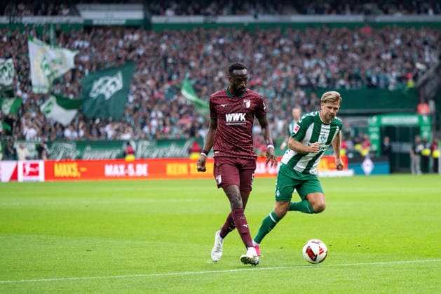 September 19, 2026, Germany, Soccer, Men s, Bundesliga 1, 2026–2027 Season, Matchday 4, SV Werder Bremen vs. FC Augsburg Chrislain Matsima (FC Augsburg), No. 5, in a tackle with Niclas Füllkrug (Werder Bremen), No. 10 DFB and DFL regulations prohibit any use of photographs as image sequences and or quasi-video Bremen Weserstadion, Bremen, Germany Copyright: xNordphoto Memmlerx