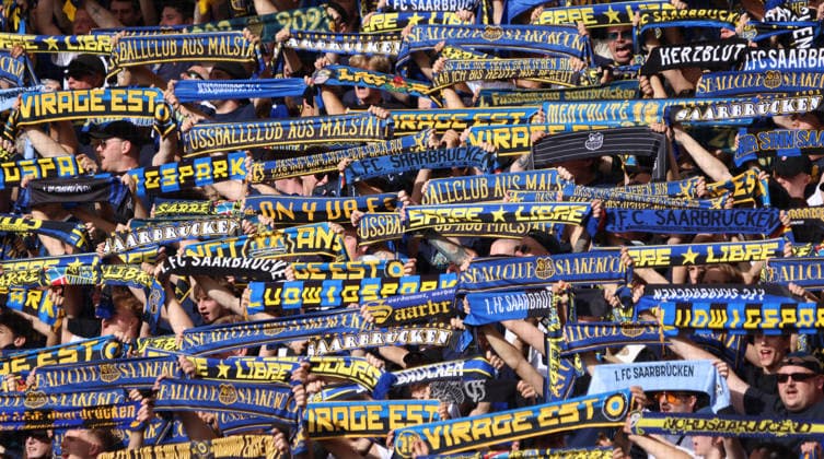 September 19, 2026, Soccer, Men’s, 3rd Division, 2026–2027 Season, 1 FC Saarbrücken vs. SG Sonnenhof Großaspach, 1 FC Saarbrücken fans hold up their scarves and sing the club anthem together at the Ludwigspark Stadium in Saarbrücken, Saarland, Germany Copyright: xFabianxKleerx