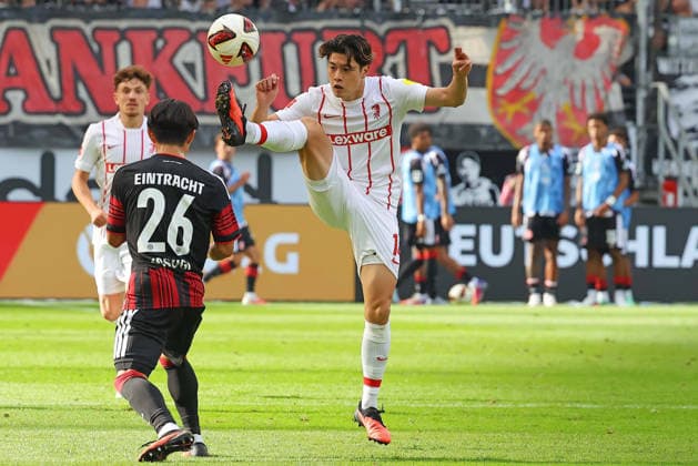Frankfurt, Germany, September 19, 2026, Bundesliga 1, 2026–2027 Season, Matchday 4: Eintracht Frankfurt vs. SC Freiburg. Pictured, from left, in a tackle: Keita Kosugi (Frankfurt) vs. Yuito Suzuki (SCF). DFL and DFB regulations prohibit any use of photographs as image sequences and or quasi-video. Deutsche Bank Park, Hesse Copyright: xFotostandx xRacochax