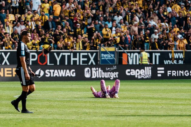 Germany Soccer 3rd Division 2026–2027, Matchday 7: Alemannia Aachen vs. Fortuna Düsseldorf at Tivoli Aachen—defeat, sadness, fans, devastated, disappointment, heads hung low, emotions, Louis Lord of Fortuna Düsseldorf, 22 minutes after the final whistle, on the ground Copyright: xThiemoxRudolphx