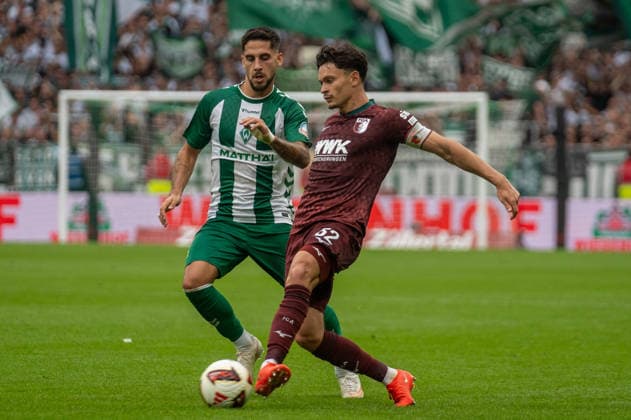 German Soccer 1st Bundesliga, Matchday 4, 2026–2027, Werder Bremen vs. FC Augsburg on September 19, 2026, at the Weserstadion in Bremen. Tackle between Fabian Rieder (FC Augsburg, 32) and Ludovit Reis (Werder Bremen, 15) Copyright: xSvenxHeidmannx