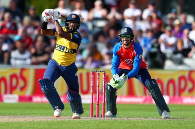 RECORD DATE NOT STATED 19th September 2026; Emirates Old Trafford Cricket Ground, Manchester, England; Mens International Twenty20 Cricket, England versus Sri Lanka; Kamindu Mendis of Sri Lanka plays down the ground watched by Jos Buttler of England RogerxEvans