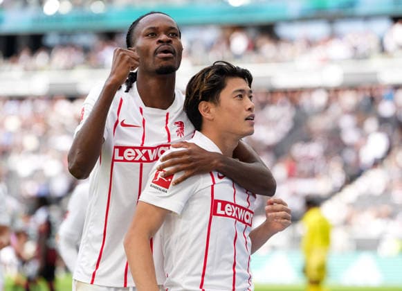 Jordy Makengo (SC Freiburg, 33) and Yuito Suzuki (SC Freiburg, 14) celebrate after a goal in the German Bundesliga match between Eintracht Frankfurt and SC Freiburg, Matchday 4, 2026–27 season, Deutsche Bank Park, Frankfurt, September 19, 2026. DFL regulations prohibit any use of photographs as image sequences and or quasi-video. Eintracht Frankfurt vs. SC Freiburg, 1. Bundesliga, Matchday 4, 2026–27 season, September 19, 2026, Frankfurt am Main Copyright: xEibner-Pressefoto ScottxColemanx EP_SCN