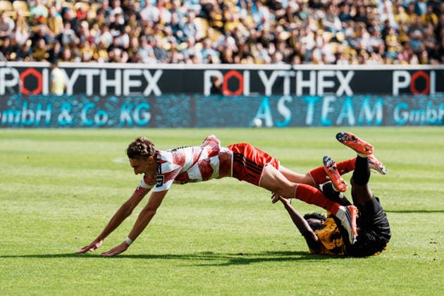 German Soccer 3rd Division 2026–2027, Matchday 7: Alemannia Aachen vs. Fortuna Düsseldorf at Tivoli Aachen—one-on-one, battle for the ball, duel, attack, tackle, sliding tackle, Gideon Jung (Alemannia Aachen, No. 21) against Lukas Eixler (Fortuna Düsseldorf, No. 11), falls, tripping, fall Copyright: xThiemoxRudolphx