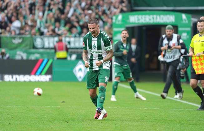 Photo: Werder players celebrating after the final whistle; pictured here is Marco Friedl. Werder Soccer, Bundesliga 1, Matchday 30 on Sat, Sept. 19, 2026: Werder Bremen vs. FC Augsburg, 3–2