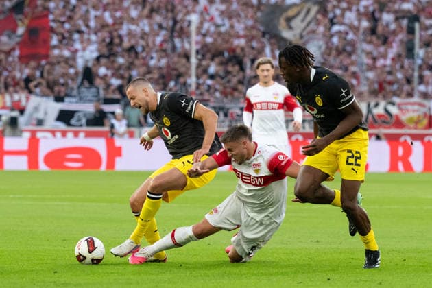 September 19, 2026, GER, Soccer, Men s, 1. Bundesliga, 2026–2027 Season, Matchday 4, VfB Stuttgart vs. Borussia Dortmund; from left, Waldemar Anton (Borussia Dortmund) in a tackle, 03, Ermedin Demirovic (VfB Stuttgart), 09, right: Joane Gadou (Borussia Dortmund), 22. DFB and DFL regulations prohibit any use of photographs as image sequences and or quasi-video. Stuttgart MHP Arena, Baden-Württemberg, Germany Copyright: xNordphoto WolfgangxFrankx